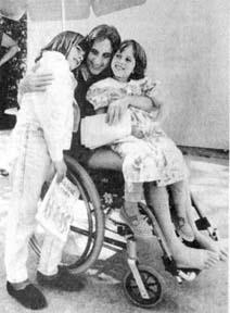 Judi Bari in wheelchair at convalescent care home visits with her daughters Lisa and Jessie. 1990 photo by David J. Cross.